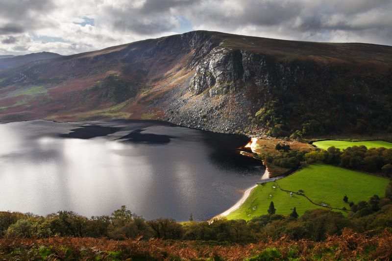Lough Tay: Co. Wicklow, Ireland. Black colour due to the peat soil surrounding the Clohouge River that feeds into it.